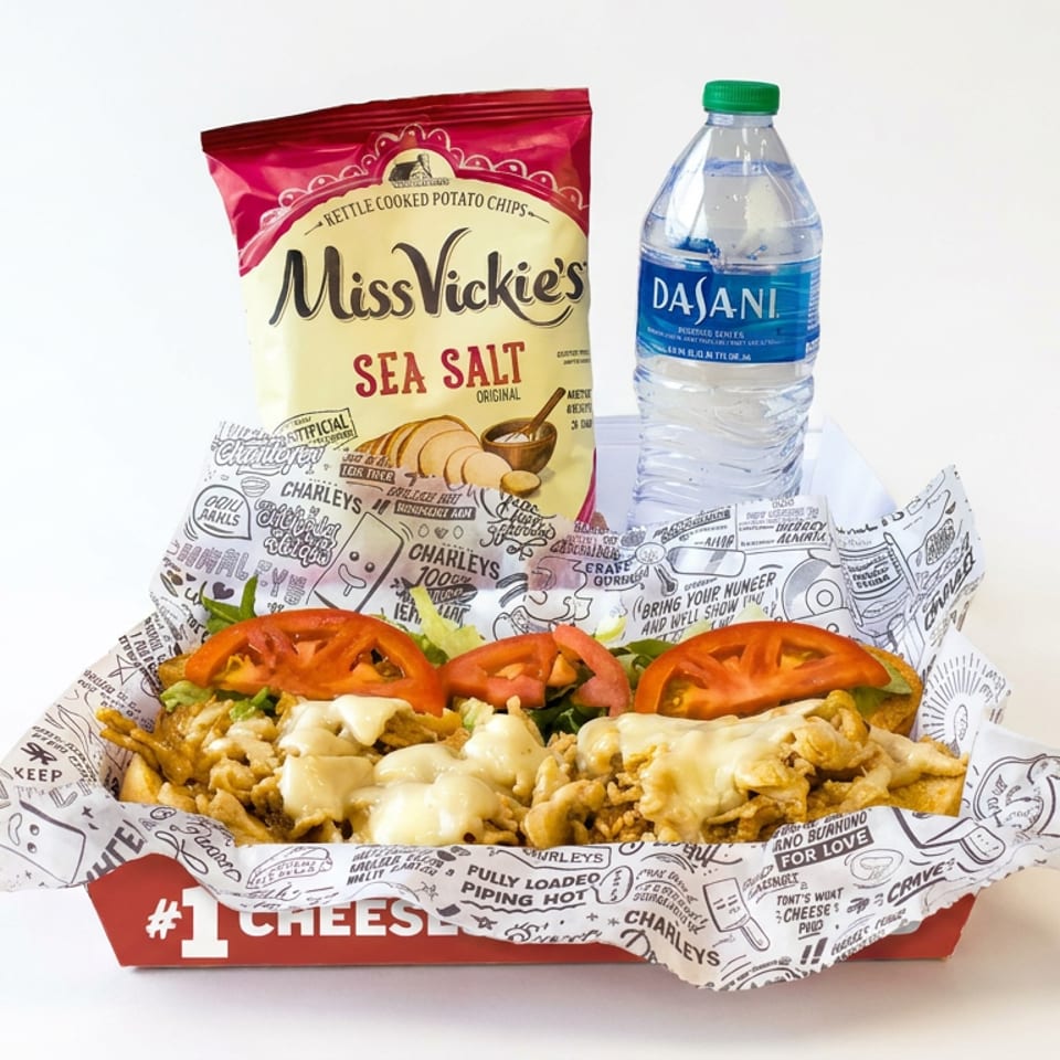 Loaded fries topped with melted cheese, tomatoes, and peppers in a Charleys wrapper, alongside Miss Vickie’s chips and bottled water.